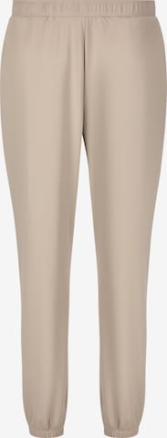Athlecia Regular Workout Pants 'Guyana' in Beige: front