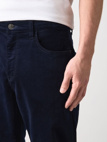 Next Slim fit Trousers 'Motionflex' in Blue