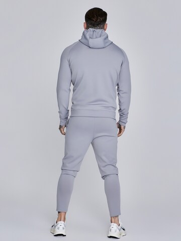 Veste de survêtement 'Poly' SikSilk en gris