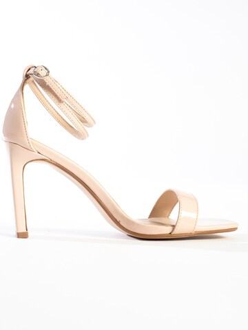 Celena - Sandalias con hebilla 'Cory' en beige
