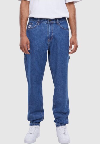 Karl Kani Tapered Jeans in Blue: front