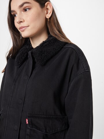 LEVI'S ® Between-season jacket 'Bubble Sherpa Trucker Jacket' in Black