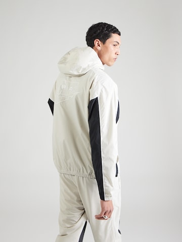 Nike Sportswear Tussenjas 'AIR' in Grijs