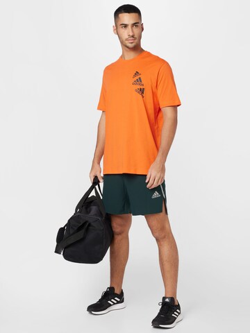 ADIDAS SPORTSWEAR - Camisa funcionais 'Essentials Brandlove' em laranja