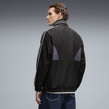 PUMA Sportjacke 'T7' in Schwarz