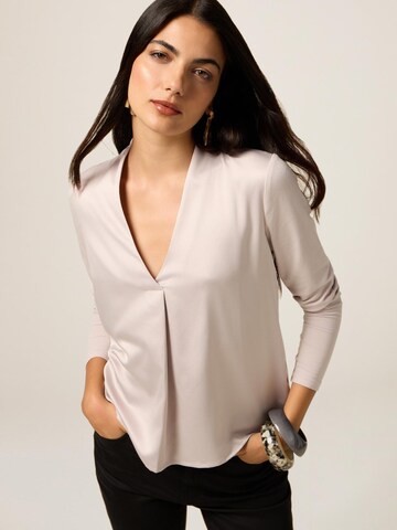 Top di oltre in beige