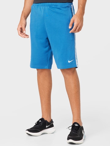 Nike Sportswear - Loosefit Calças em azul: frente