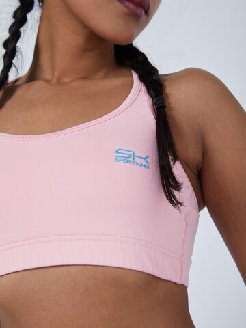 SPORTKIND BH 'Crossed Straps' in Pink: Vorderseite