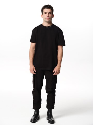 ABOUT YOU x Jaime Lorente Tapered Cargo trousers 'Adriano' in Black