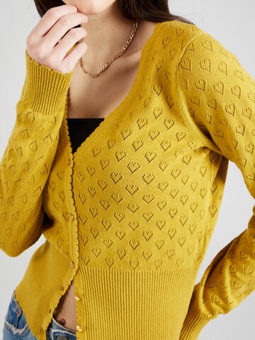 Cardigan King Louie en jaune