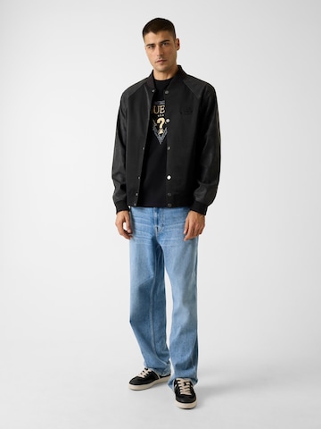 GUESS - Camiseta en negro: frente