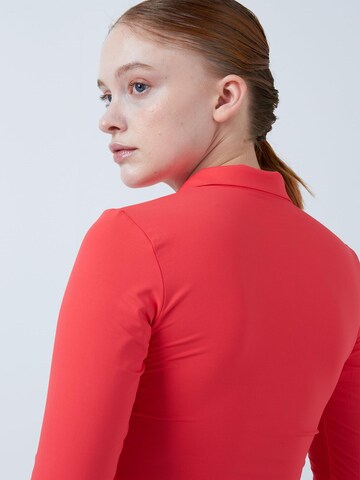 SPORTKIND Funktionsshirt 'Poloshirt Langarm'‌‌‌‌‌‌ in Orange