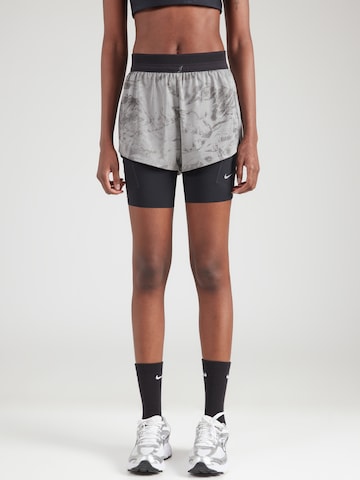 NIKE Slimfit Športne hlače 'SWFT' | siva barva: sprednja stran