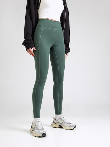 Girlfriend Collective Skinny Workout Pants in Green: front