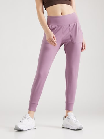 UNDER ARMOUR Tapered Workout Pants 'Motion' in Purple: front