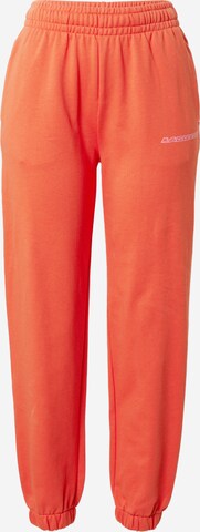 LACOSTE Tapered Broek in Oranje: voorkant