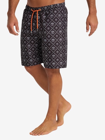 Carlo Colucci Board Shorts in Black: front