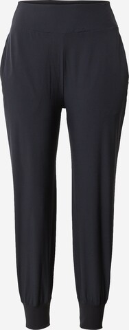 NIKE Tapered Sports trousers in Black: front