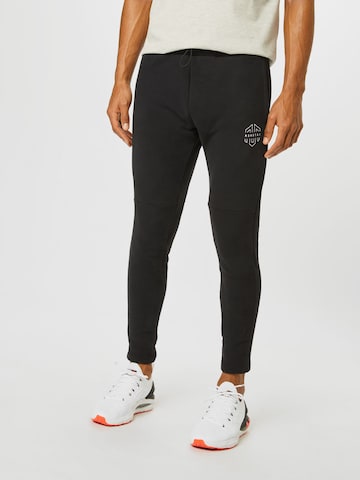 MOROTAI Tapered Workout Pants in Black: front