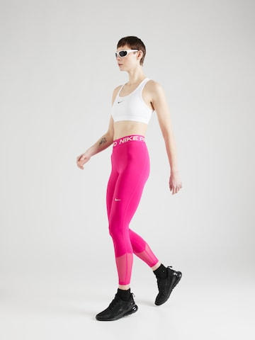 Skinny Pantaloni sport de la NIKE pe roz