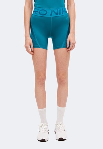 Skinny Pantalon de sport 'NP' NIKE en vert : devant