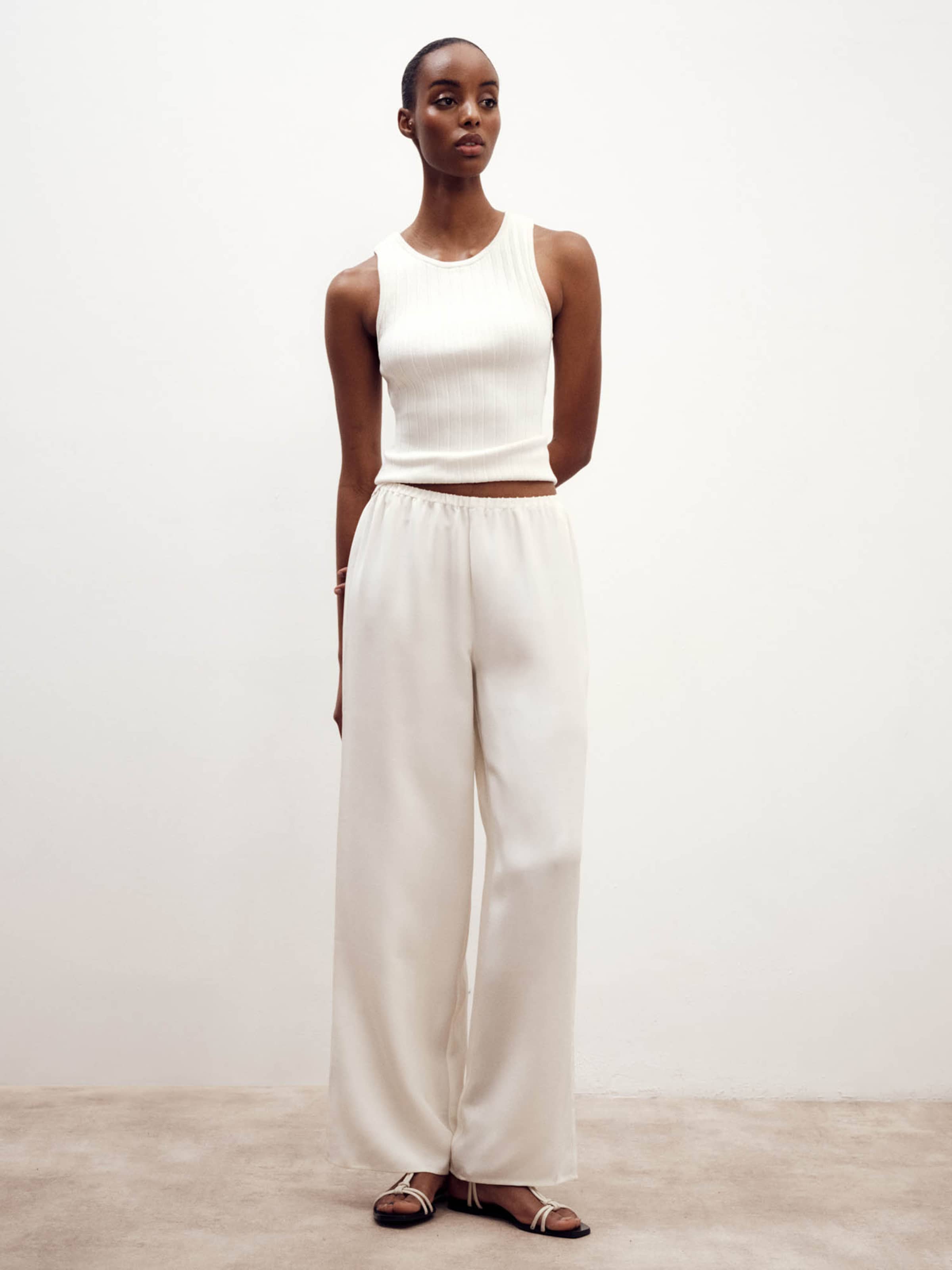 ABOUT YOU x Marie von Behrens Wide leg Pants 'Paula' in Natural