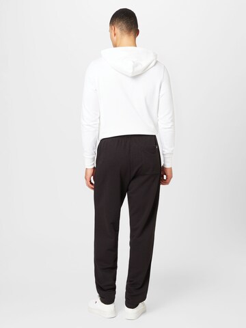 Tommy Jeans Tapered Hose in Schwarz