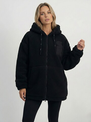 SUPERREBEL® GEAR Between-seasons coat 'JOAN_' in Black: front
