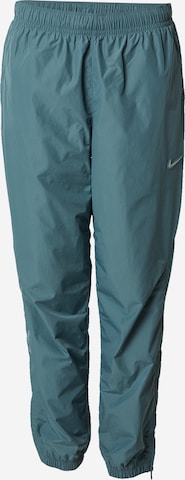 žalia Nike Sportswear Siaurėjantis Kelnės 'NOCTA': priekis