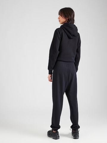 Tapered Pantaloni di Champion Authentic Athletic Apparel in nero