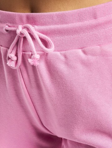 ADIDAS ORIGINALS Rozkloszowany krój Spodnie w kolorze różowy