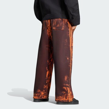 ADIDAS ORIGINALSWide Leg/ Široke nogavice Hlače 'Adilenium 6' - narančasta boja