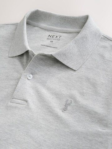 T-Shirt Next en gris