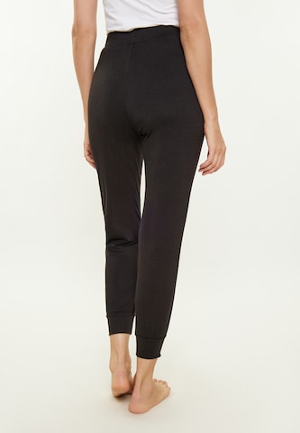 Usha - Tapered Pantalón 'Fashion Look' en negro