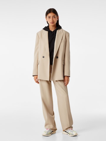 Bershka Loose fit Pleat-front trousers in Beige