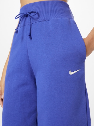 lillā Nike Sportswear Pakapēniski sašaurināts piegriezums Bikses 'PHNX FLC'