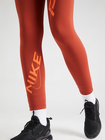 NIKE Skinny Športne hlače | oranžna barva