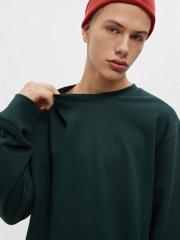 Bluză de molton de la Pull&Bear pe verde