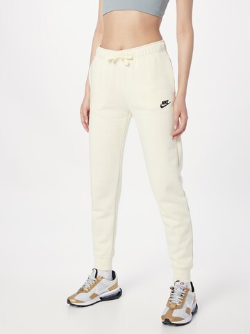 Nike Sportswear Tapered Pants in Beige: front