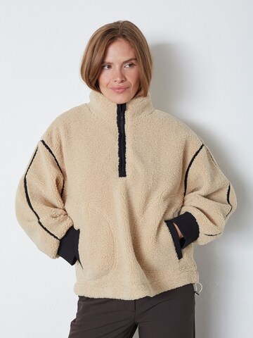 Pull-over 'Madin' co'couture en beige : devant
