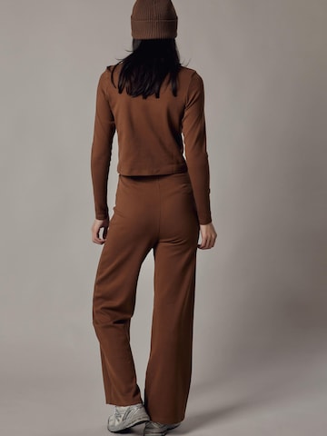 Flared Pantaloni 'Panta Palazzo in Interlock' di OWN Off With Nature in marrone