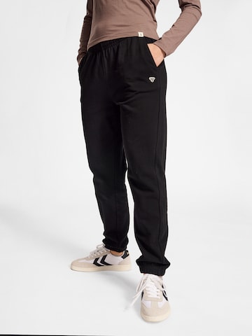 Effilé Pantalon de sport Hummel en noir