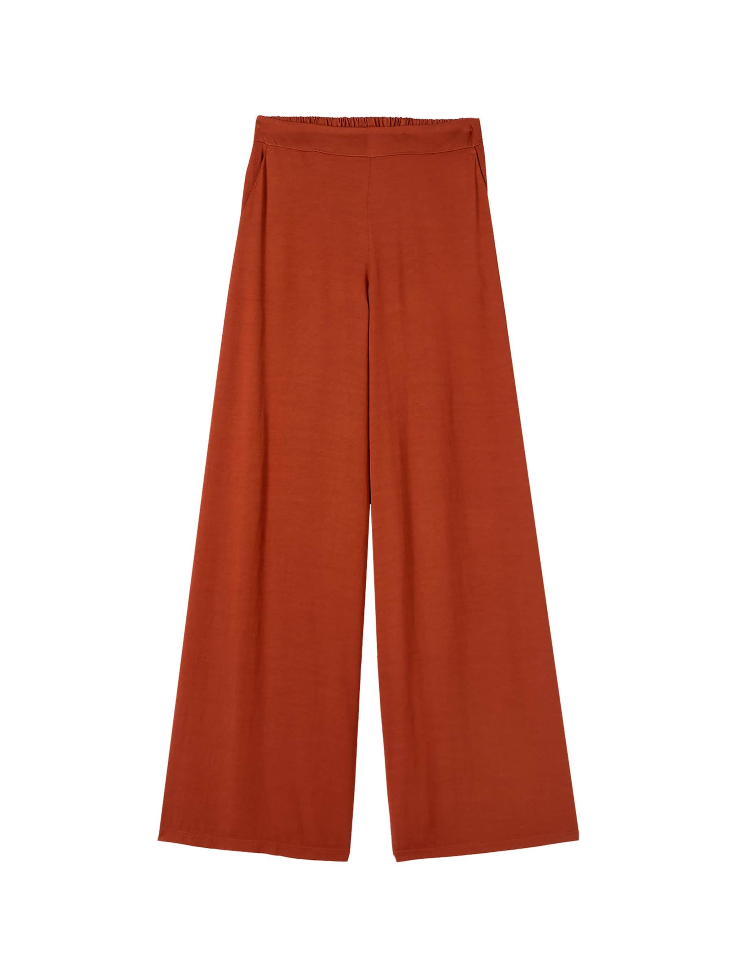 oltre Baggy Trousers in Orange: front
