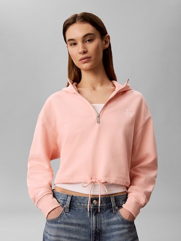 Sweat-shirt Calvin Klein Jeans en orange : devant