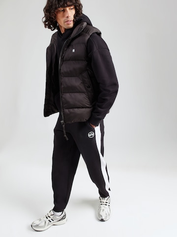 ALPHA INDUSTRIES Конический (Tapered) Штаны 'Studio' в Черный