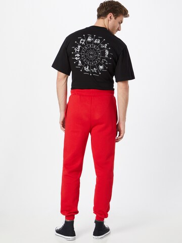 ABOUT YOU Limited - Loosefit Pantalón 'Marlon' en rojo