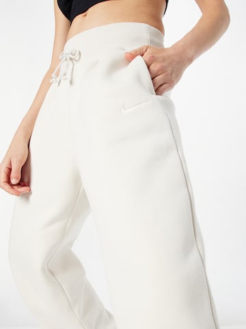 balta Nike Sportswear Siaurėjantis Kelnės 'PHOENIX FLEECE'