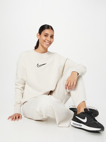 Nike SportswearSweater majica 'PHNX FLC' - bež boja
