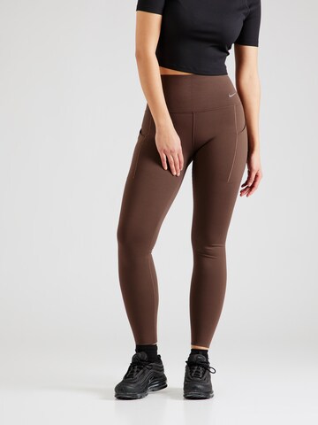 NIKE Skinny Workout Pants 'UNIVERSA' in Brown: front