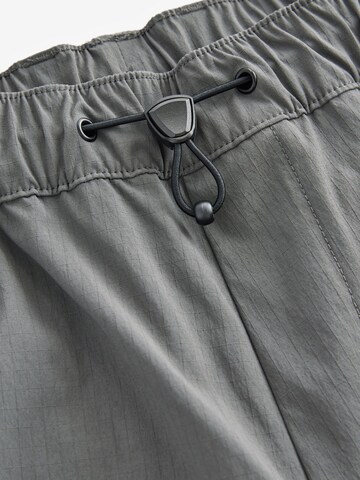 regular Pantaloni di Next in grigio
